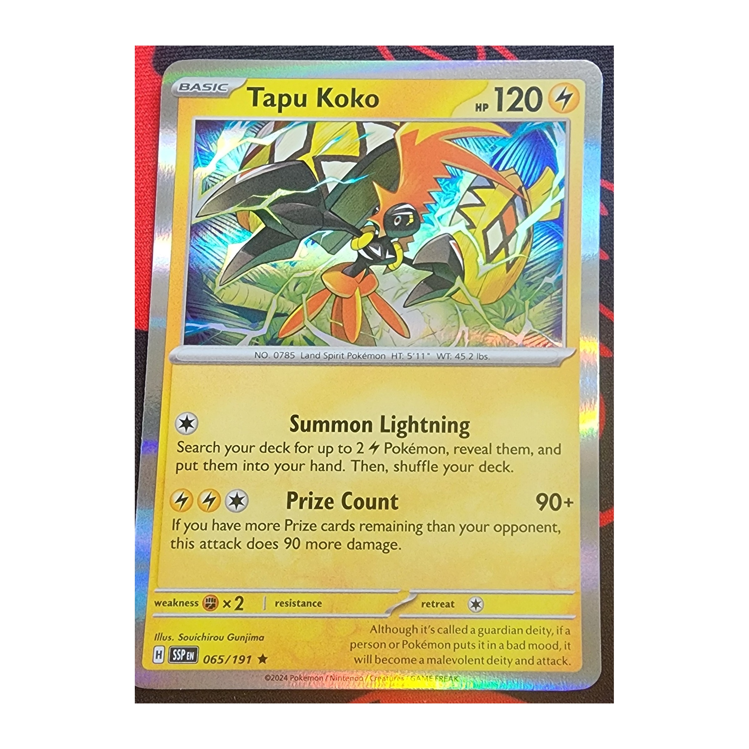 Tapu Koko Rare SV08: Surging Sparks 065/191 NM Holo