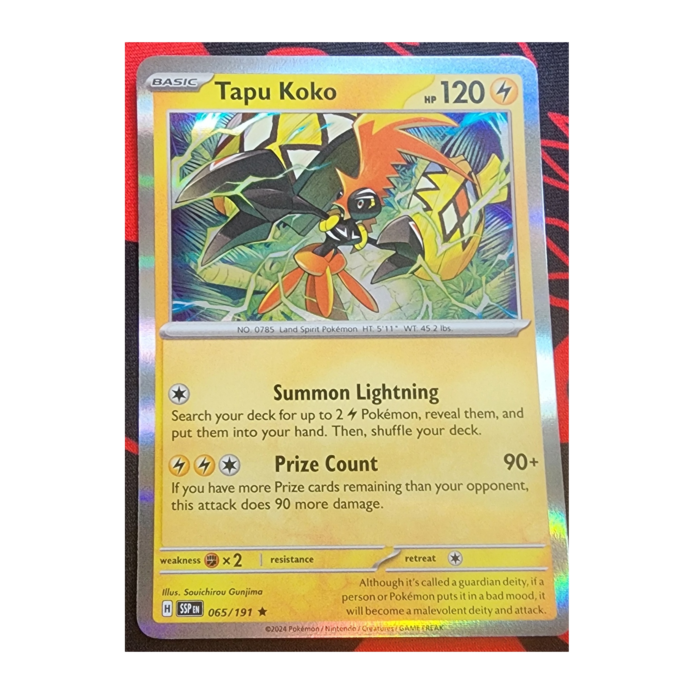 Tapu Koko Rare SV08: Surging Sparks 065/191 NM Reverse Holo